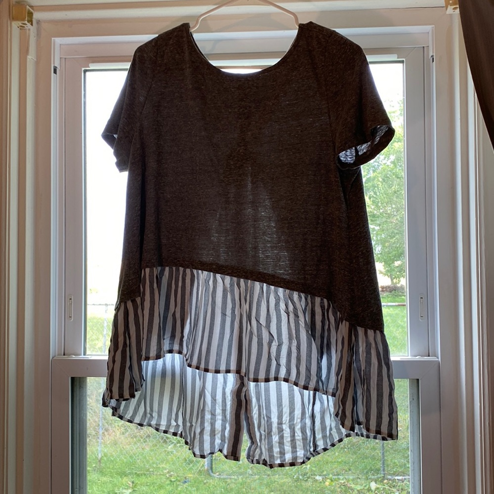 Medium gray shirt with gray and white stripes and has buttons on the back.